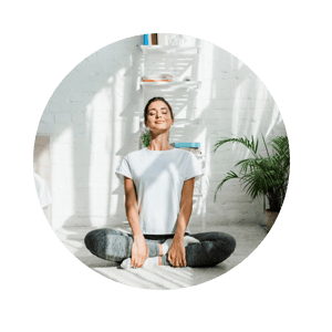 Woman Doing Yoga In Lotus Pose At Home