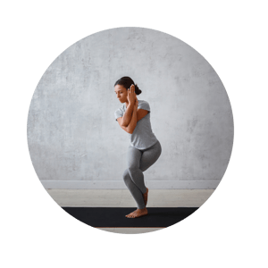 woman holding a  yoga pose at home