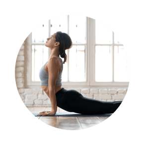 Young Woman Doing Yoga At Studio, Cobra  Pose 