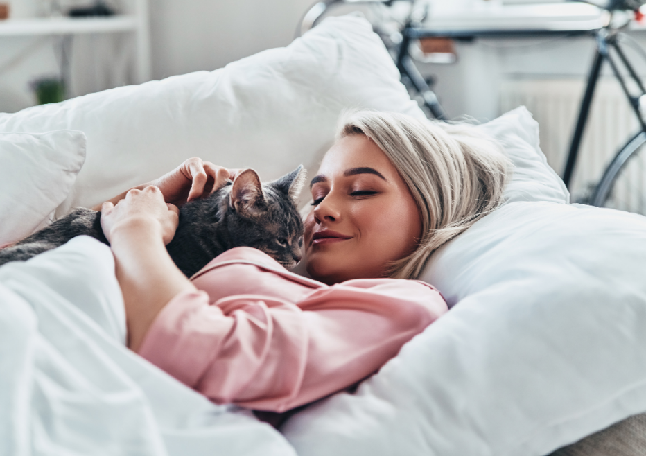 woman resting on the couch with her cat