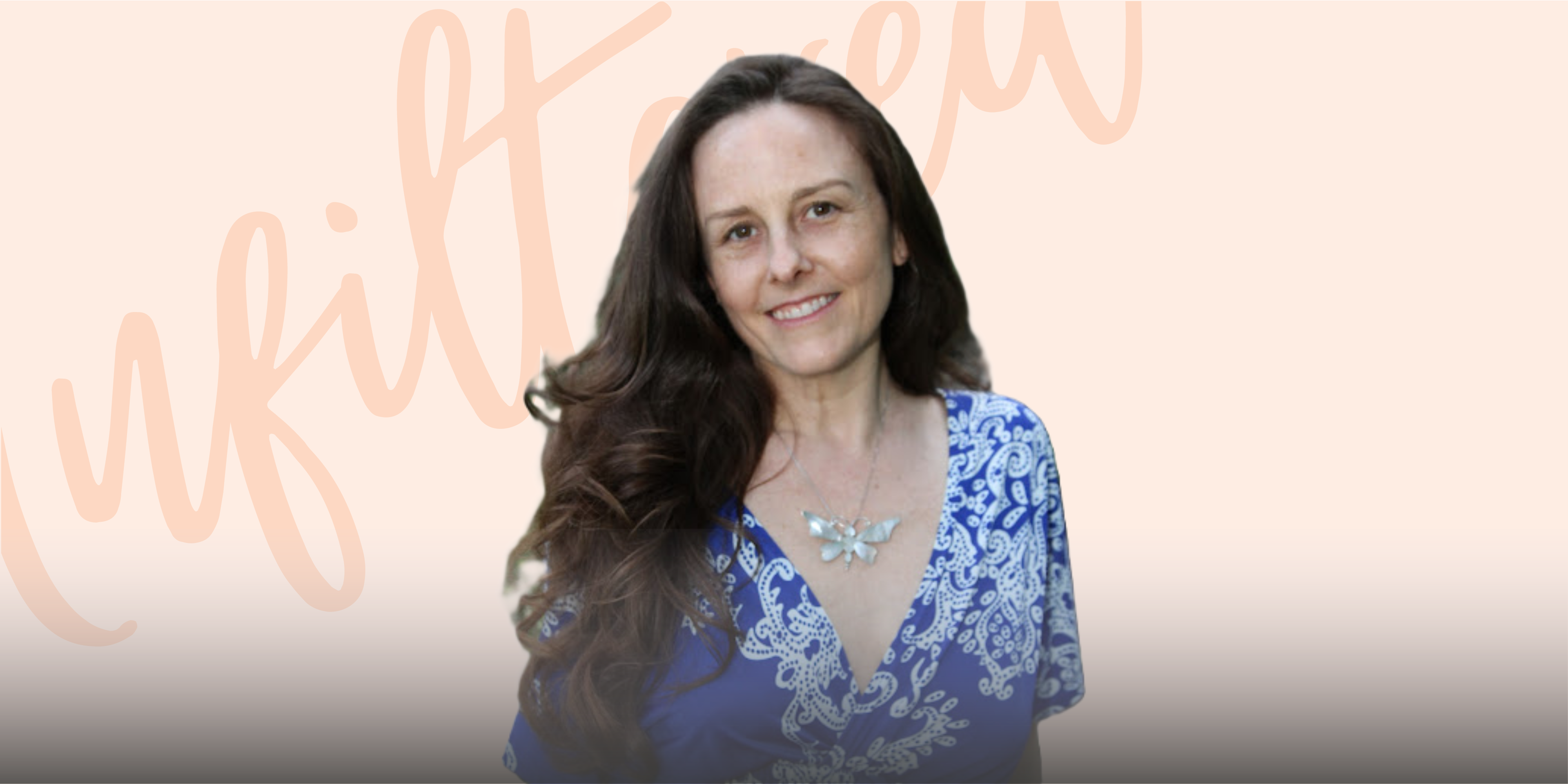 Kristen O'Guin wearing a blue dress and a butterfly necklace, smiling warmly at the camera against a soft background.